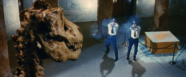 The security guards stopped the dinosaur skeleton with their guns and saved the day